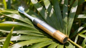 Eco-friendly electric toothbrush with bamboo and green leaves.